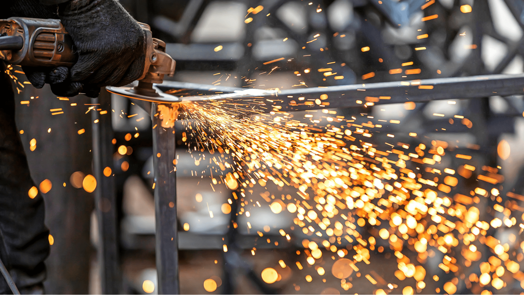 man welding a base with sheet metal