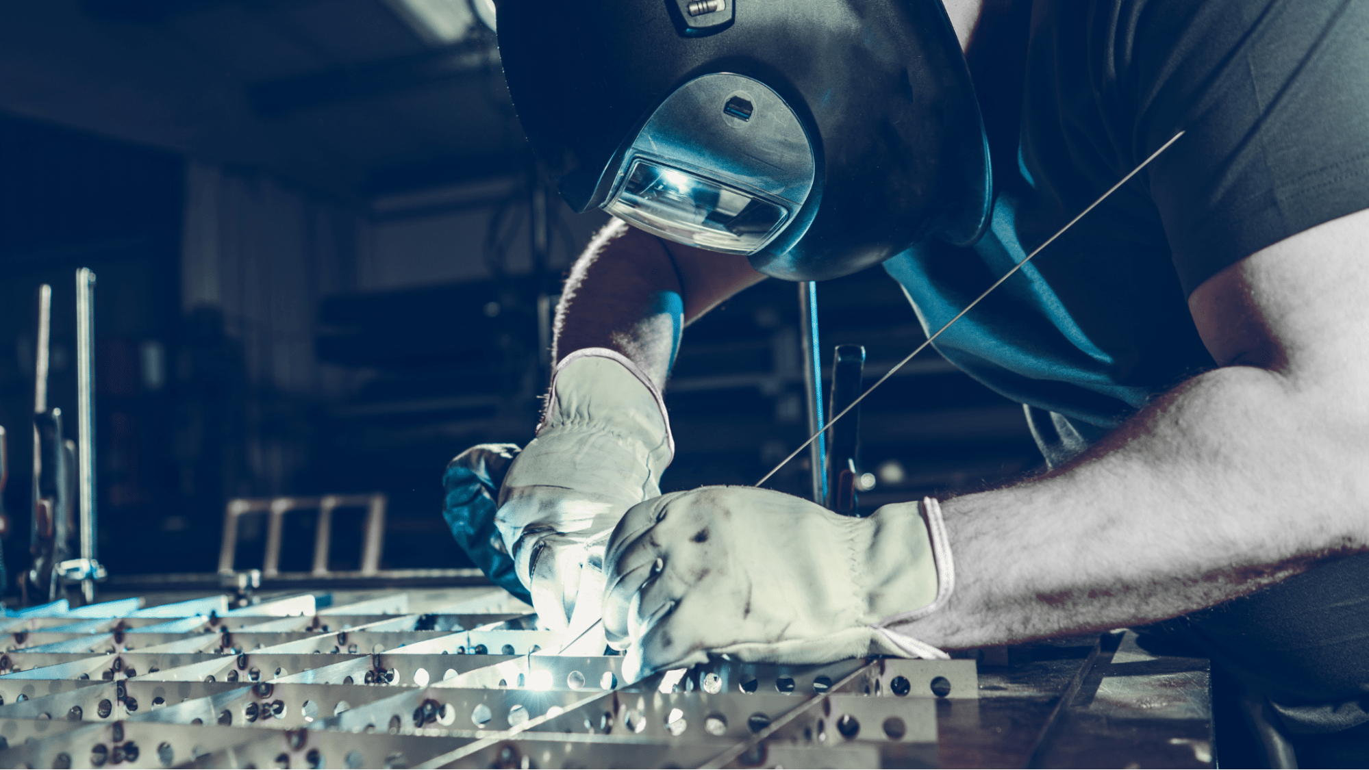 man shaping custom sheet metal designs